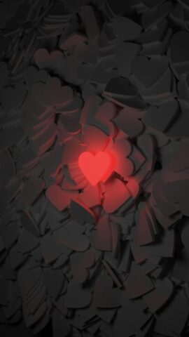 Photo by Cocodillaa.com a red heart surrounded by black hearts