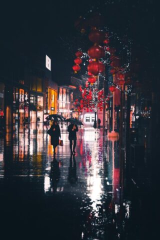 Photo by Cocodillaa.com people walking holding umbrella at night
