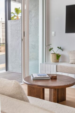 a living room with a couch a table and a tv