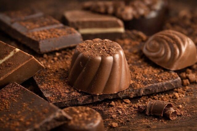 Photo by Cocodillaa.com chocolate, pralines, cocoa, sweets, sweet, dessert, dark chocolate, milk chocolate, chocolate bars, rippled pattern, texture, gourmet, confectionery, chocolate pieces, decadent, luxury, food photography, chocolate flavor, confectionery art, quality chocolate, decoration