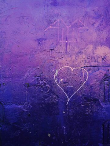 Photo by Cocodillaa.com a purple wall with a heart drawn on it
