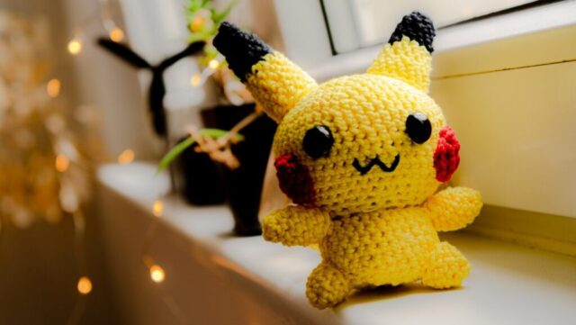 Photo by Cocodillaa.com A crochet pikachu is happily displayed on a windowsill.