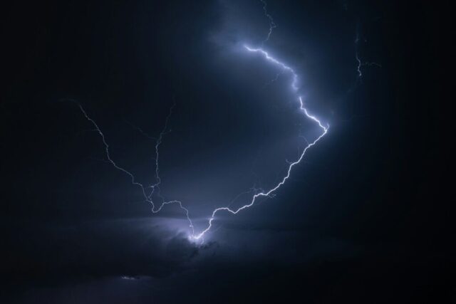 Photo by Cocodillaa.com Lightning streaks across the dark sky.