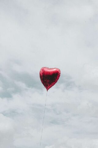 Photo by Cocodillaa.com red heart balloon under cloudy sky