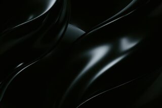 Photo by Pawel Czerwinski an abstract black background with wavy lines