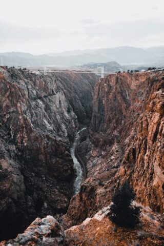 Photo by Cocodillaa.com brown rocky mountain under white sky during daytime
