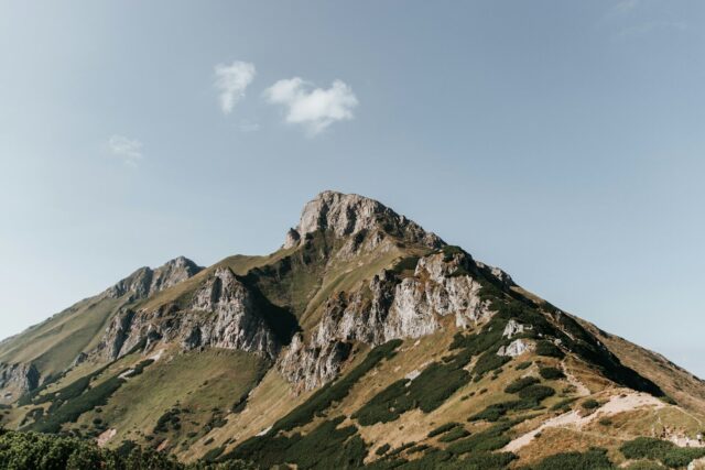 Photo by Cocodillaa.com green and brown mountain under blue sky during daytime