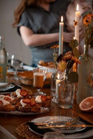 Photo by Cocodillaa.com a table topped with a pizza covered in toppings