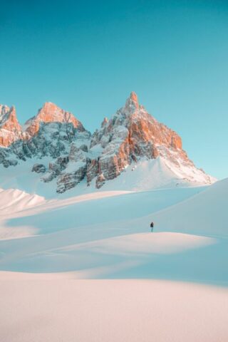 Photo by Cocodillaa.com person walking on snow covered mountain during daytime