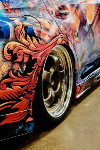 A colorful car parked in a parking lot