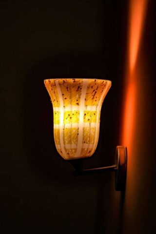 Photo by Cocodillaa.com a light that is on the side of a wall