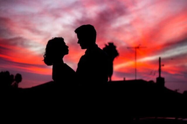 Photo by Cocodillaa.com silhouette of man and woman facing each other during golden hour
