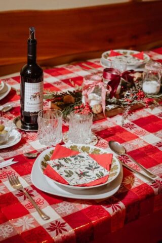 Photo by Cocodillaa.com a red and white table with a bottle of wine