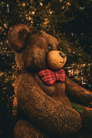 Photo by Cocodillaa.com A large teddy bear with a red bow tie.