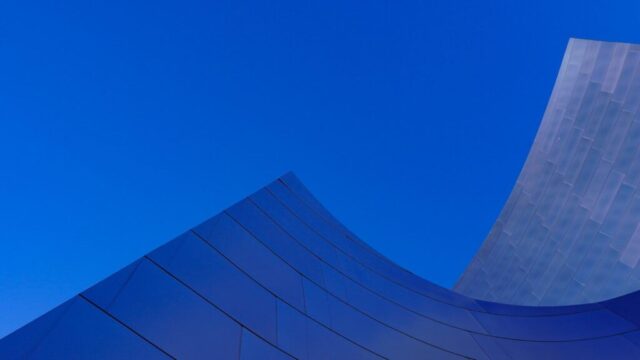 Photo by Cocodillaa.com blue glass building under blue sky during daytime