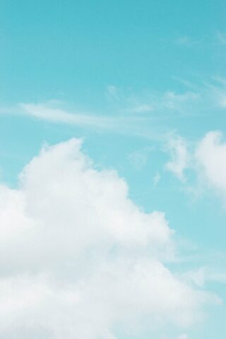 Photo by Cocodillaa.com a plane is flying high in the sky