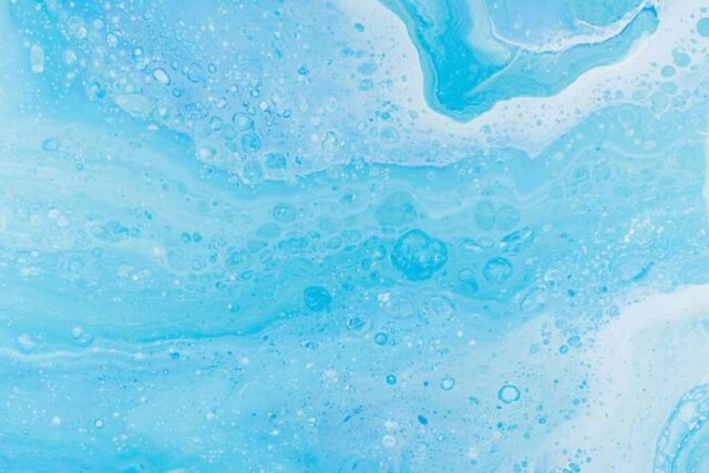 Photo by Cocodillaa.com a close up of a blue and white liquid