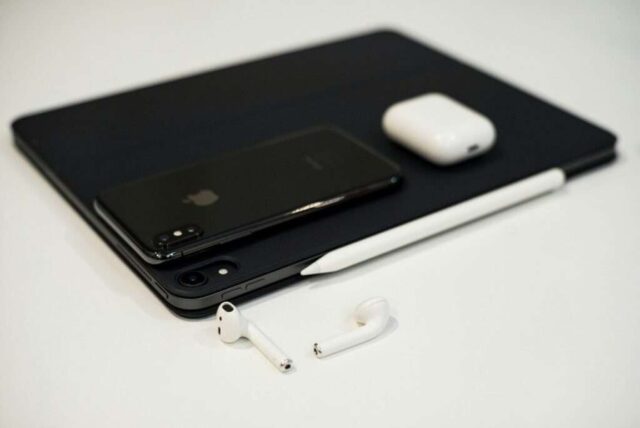 black iPhone x on black iPad