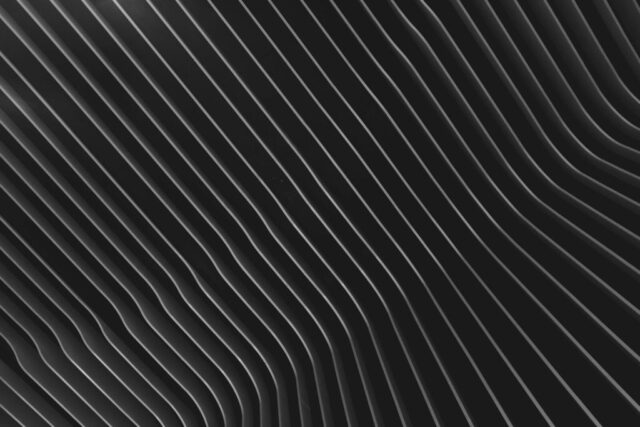 Photo by Cocodillaa.com a black and white abstract background with wavy lines