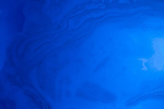 Photo by Cocodillaa.com a close up view of a blue liquid