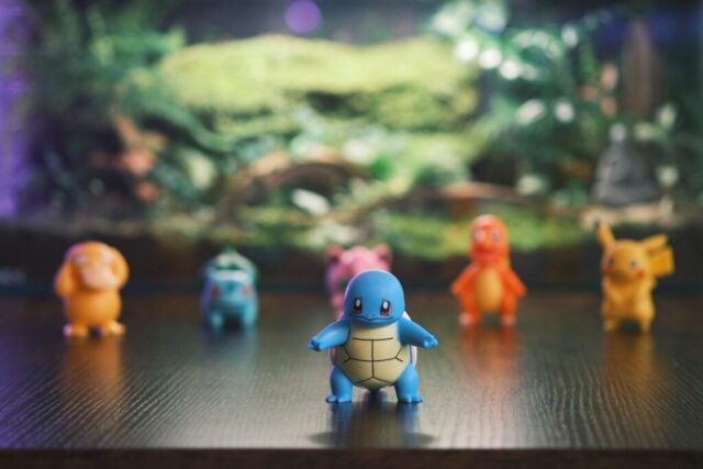 Photo by Cocodillaa.com Several pokemon figurines arranged on a surface.