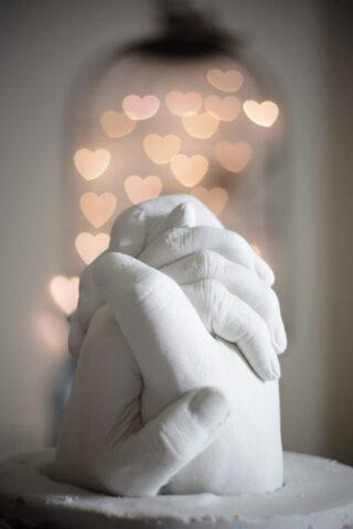 Photo by Cocodillaa.com selective focus of holding hands figurine