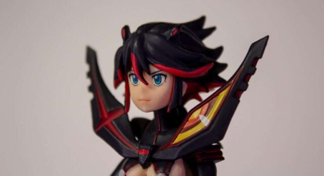 black haired girl in black and red dress anime character