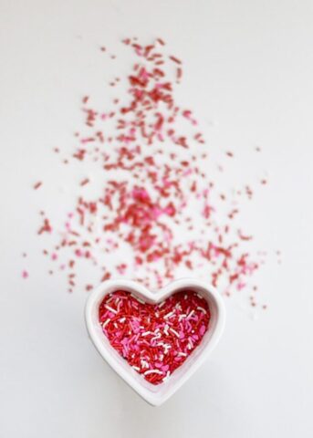 Photo by Cocodillaa.com selective focus photo ofsprinkles in heart ceramic bowl