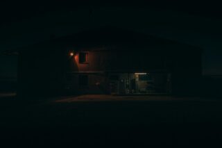Photo by Ralph Darabos a dark house with a light on at night