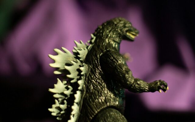 Photo by cocodillaa.com Godzilla toy figure with purple background