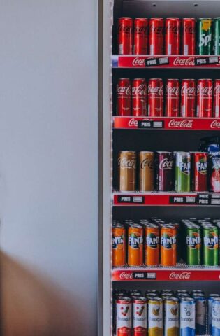 a vending machine filled with cans of soda