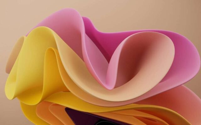 a close up of a cell phone with a colorful background