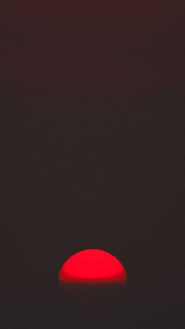 red textile on black background