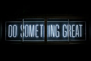 Photo by Clark Tibbs Do Something Great neon sign