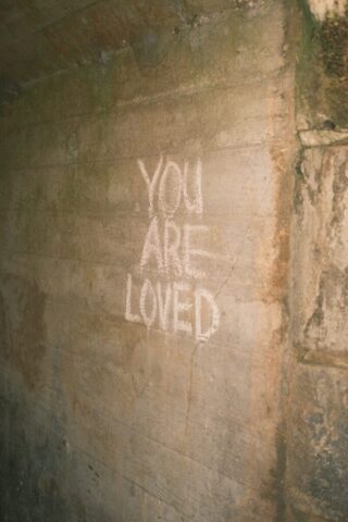 Photo by Cocodillaa.com you are loved written on the side of a wall
