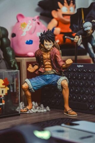 a figurine of a man sitting on a desk