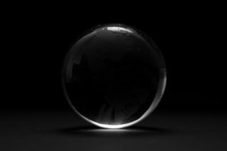 Photo by amirali mirhashemian round clear ball with black background