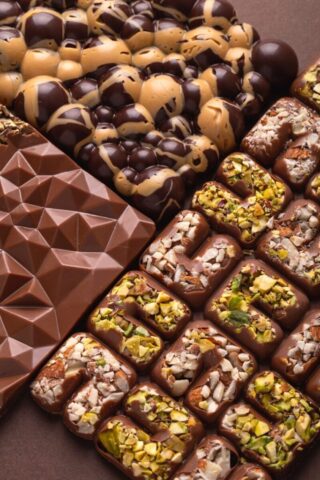 Photo by Cocodillaa.com a table topped with lots of different types of chocolate