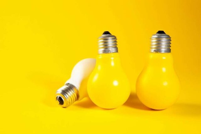 Photo by Cocodillaa.com Three yellow light bulbs on a yellow background.