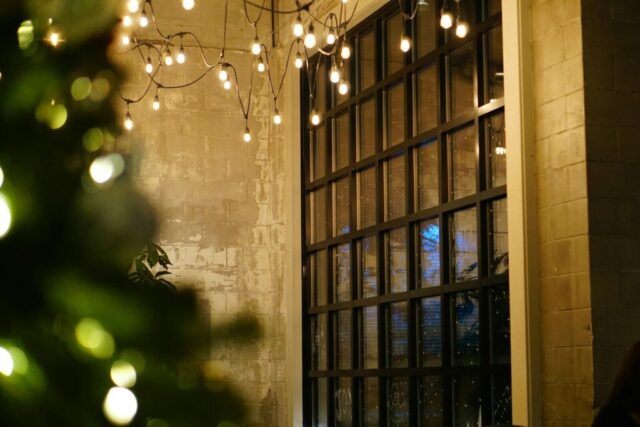 a room with a bunch of lights hanging from the ceiling