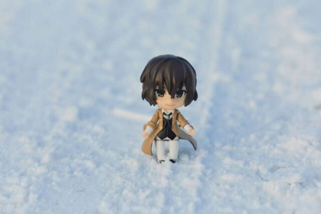 black haired girl in white dress figurine