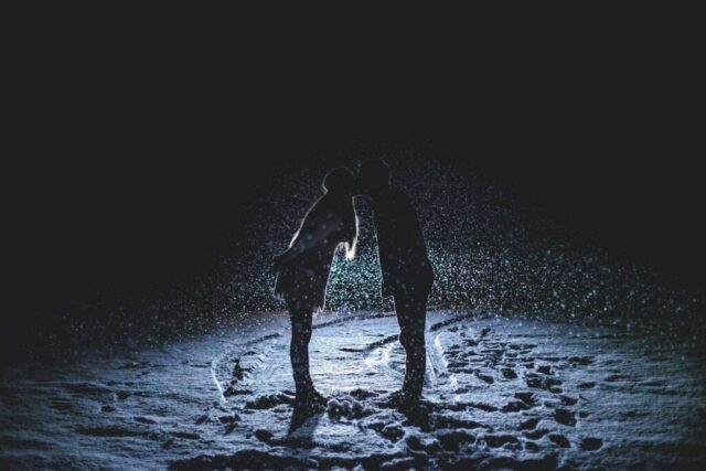 Photo by Cocodillaa.com man and woman kissing in the middle of the rain
