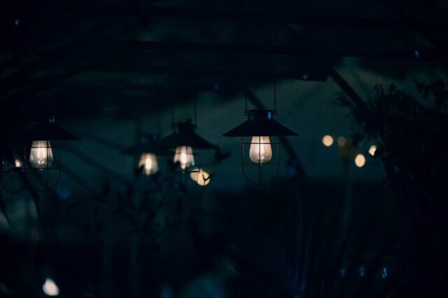 a group of lights hanging from a ceiling