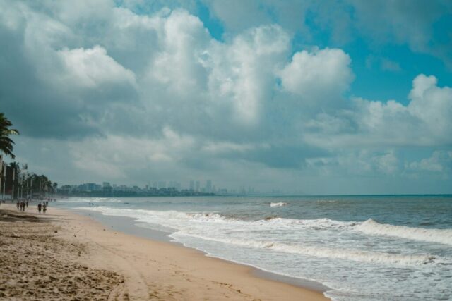 a beach with waves crashing on it