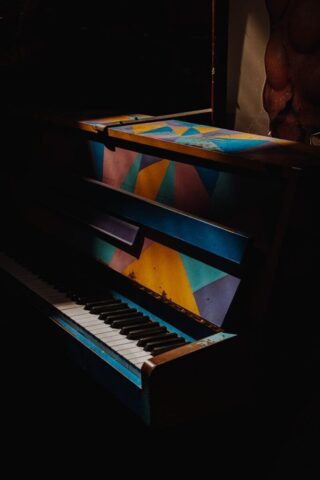 blue and white upright piano