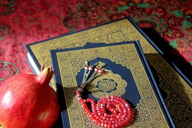 Photo by Cocodillaa.com A red apple sitting on top of a book