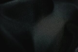 Photo by Cocodillaa.com a close up of a black fabric texture