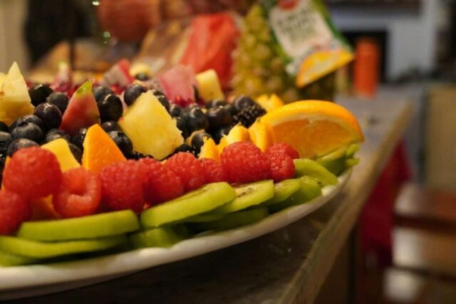 a plate of fruit is on a table