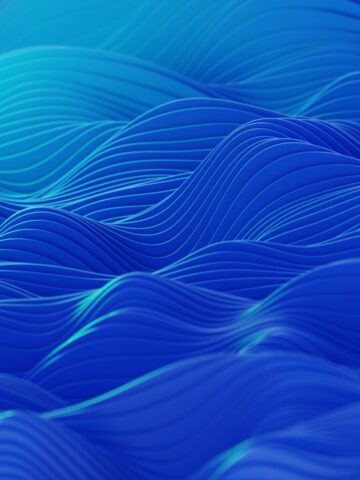 Photo by Cocodillaa.com an abstract blue background with wavy lines