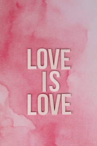 Inspirational 'Love Is Love' text on a vibrant pink watercolor background.